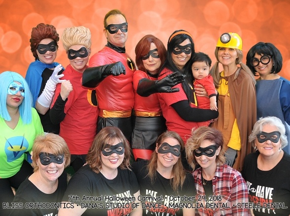 Doctor Steele and her pediatric dental team wearing superhero costumes