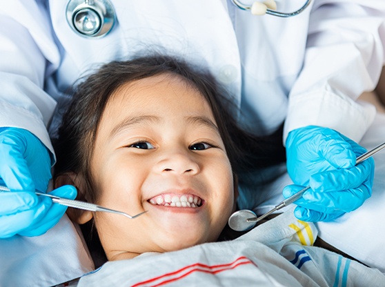 Patient smiling while in the dentist’s chair