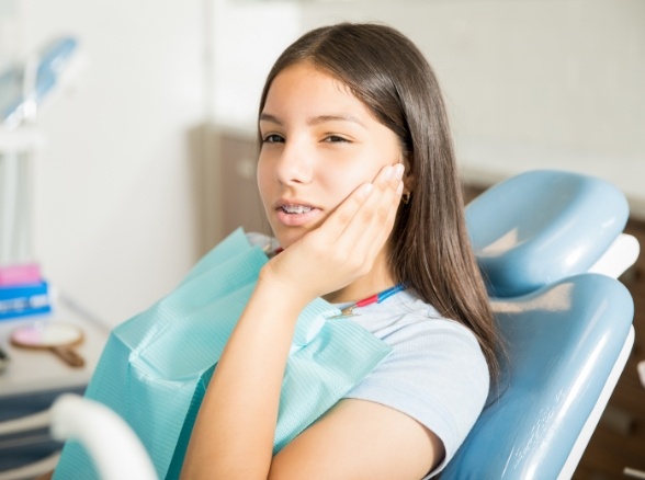 Young girl at dental office for emergency dentistry