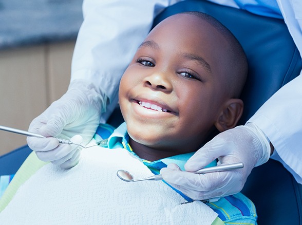smiling child in a dental chair