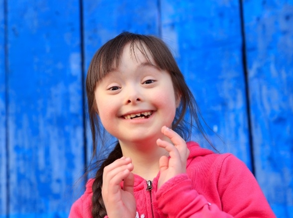 Young girl smiling after special needs dentistry visit