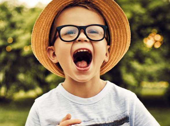 Child laughing after restorative dentistry treatment