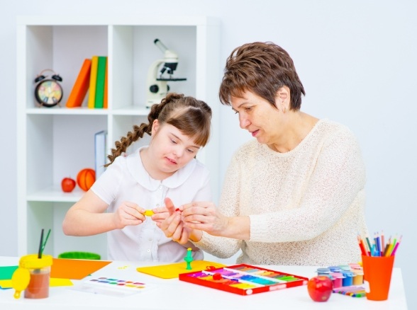 Child and mother in waiting room before sedation dentistry special needs dental visit