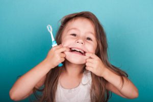 a child brushing their teeth