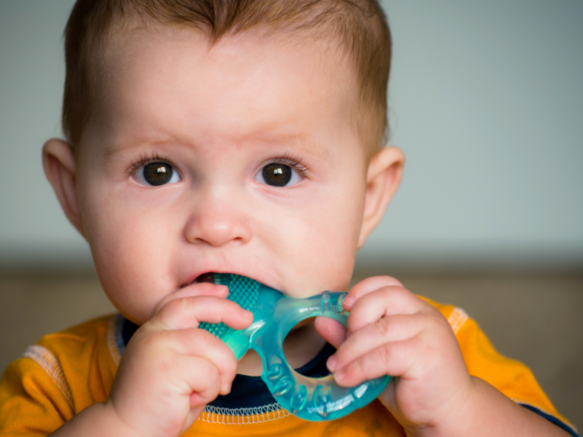 Baby with teething ring