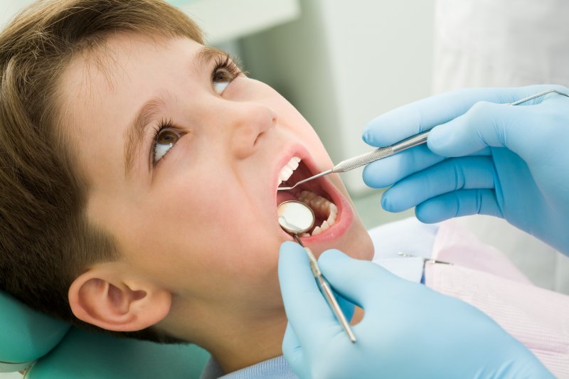 little boy undergoing a dental checkup
