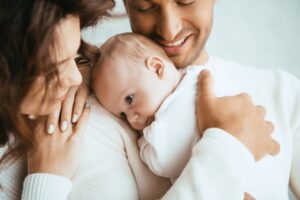 Parents holding their baby.