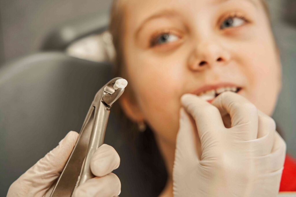 Girl with an extracted tooth