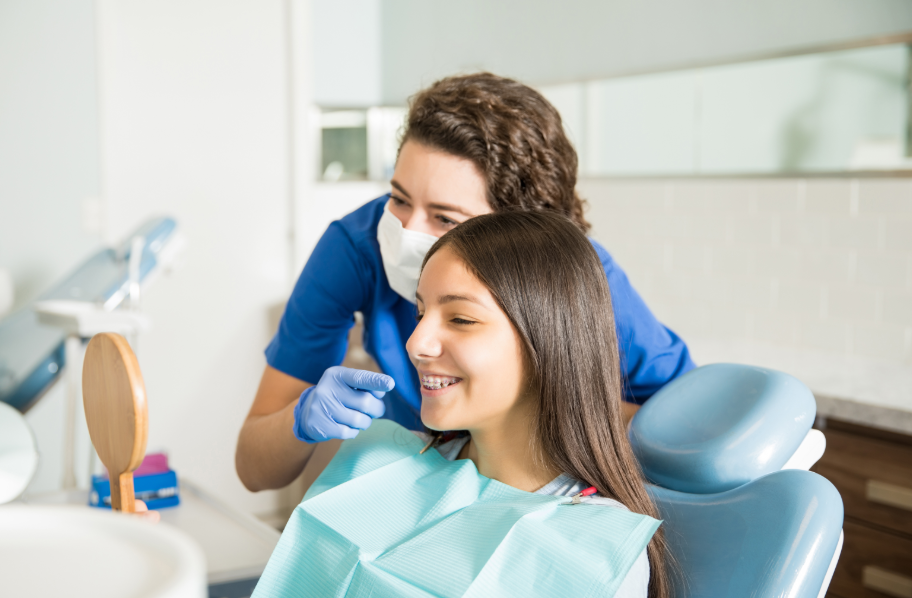 Tween smiling in dental chair